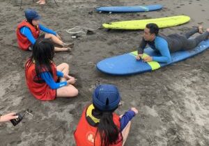 Chris teaching at surf camp 2019